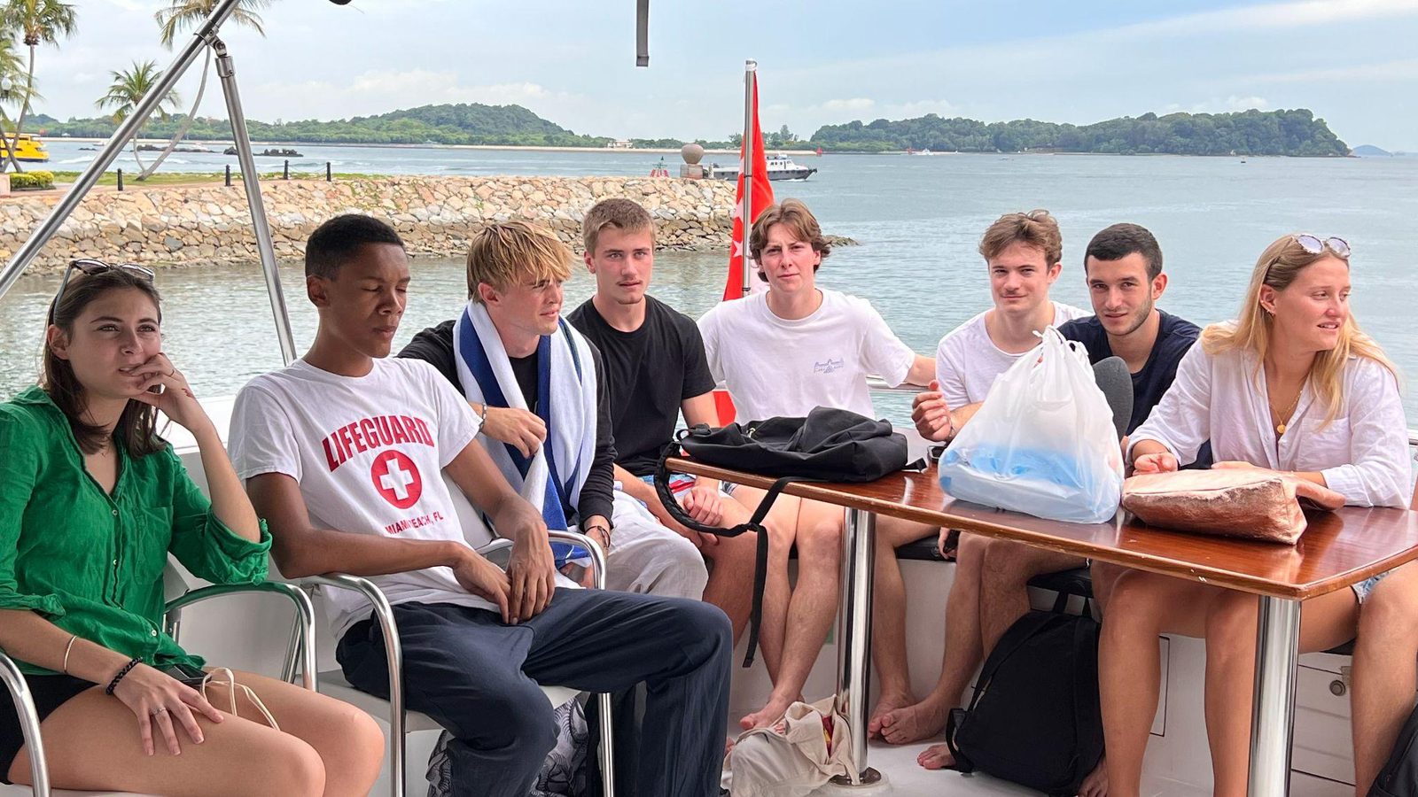 A visiting student group on a harbour boat outing in Singapore