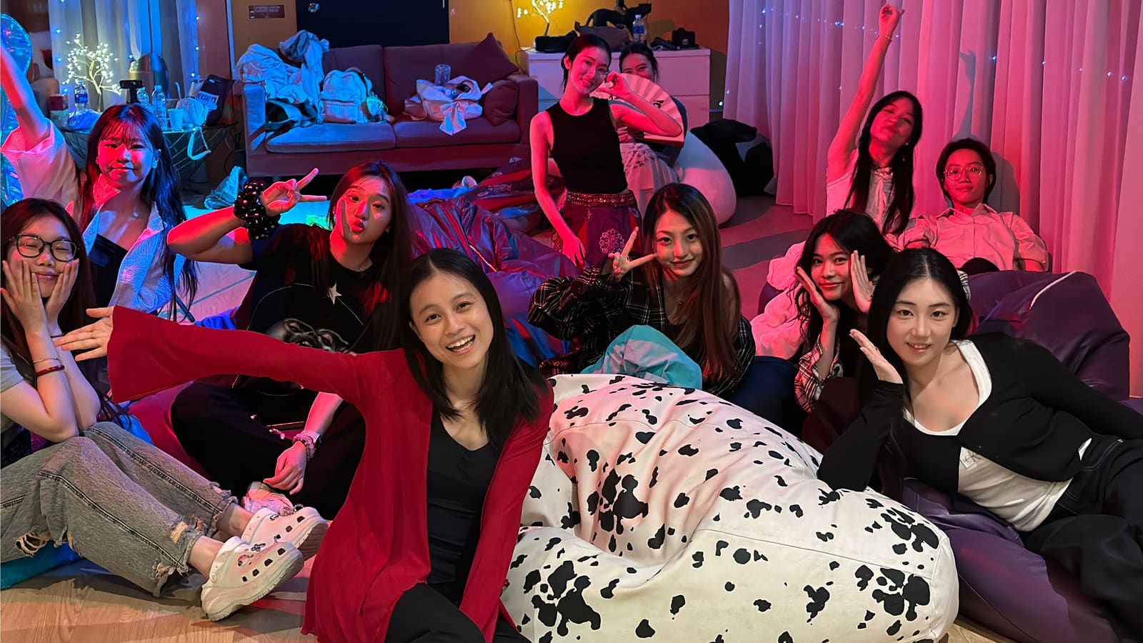 A games night in the Nintendo Lounge — friends on bean bags under party lighting