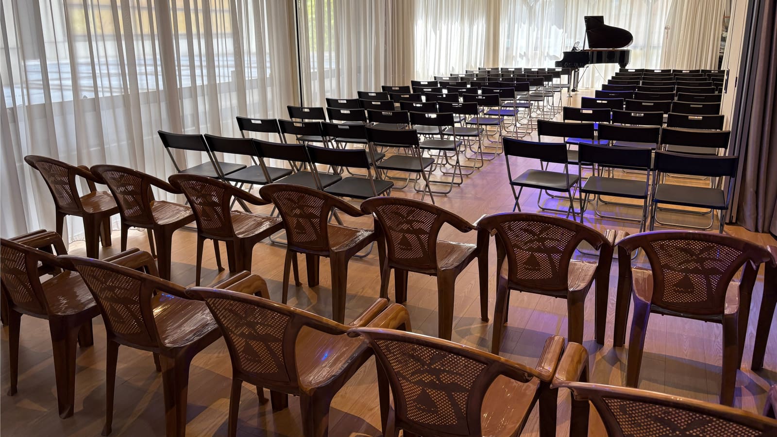 A recital setup under stage lighting